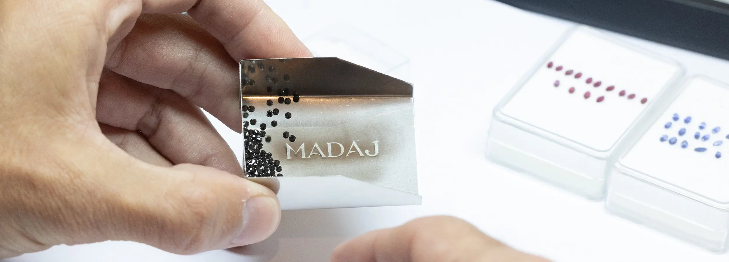 Sorting black diamonds on an engraved MADAJ scoop