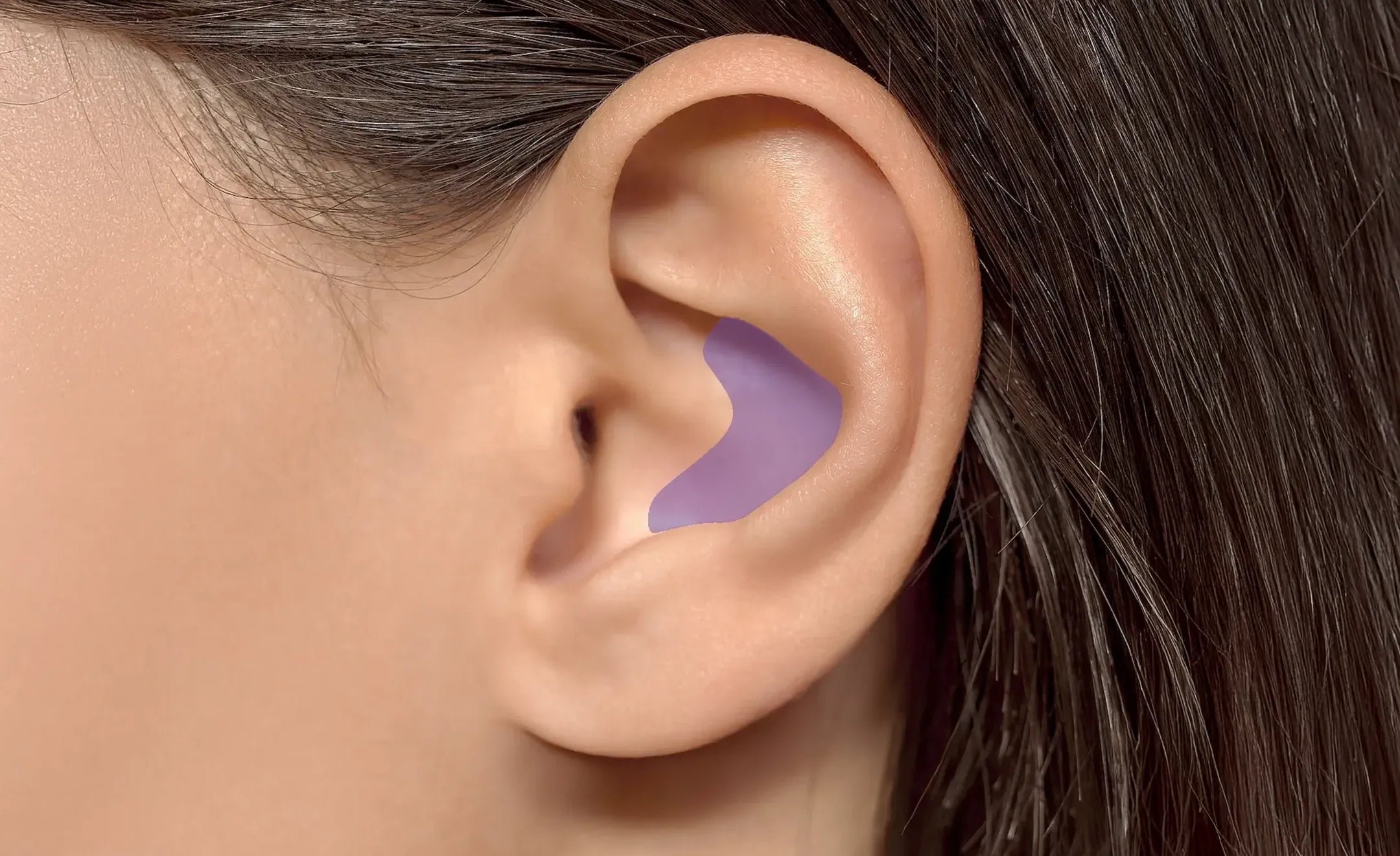 Close-up of a human ear with a purple curved highlighting the conch part of the ear