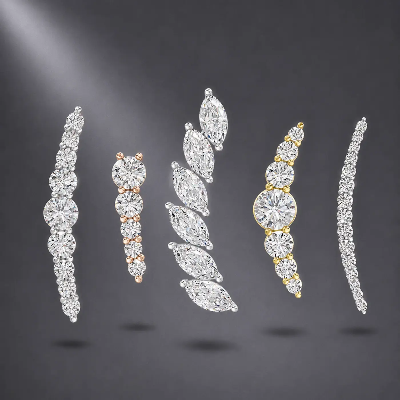 Set of diamond ear climbers on a dark background